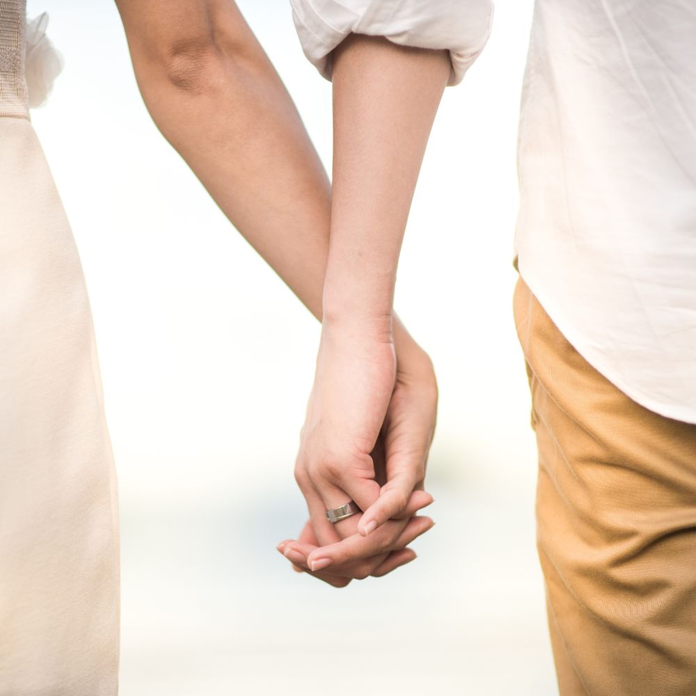 Couple holding hands