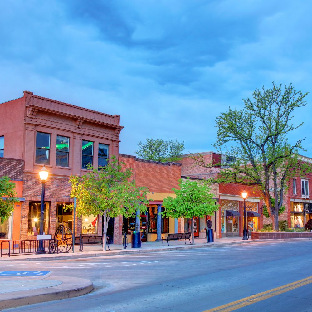 Colorful small-town street with shops and trees in Grand Junction, CO