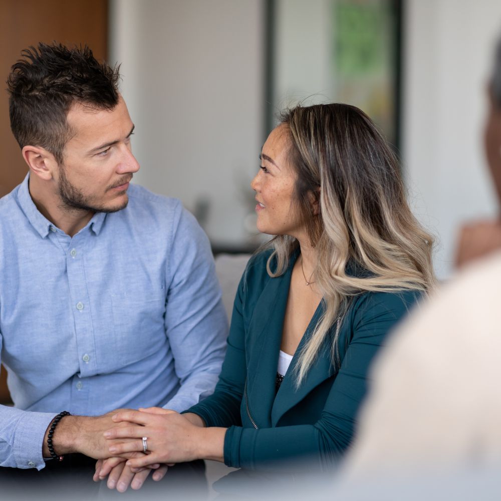Couple smiling warmly during therapy session