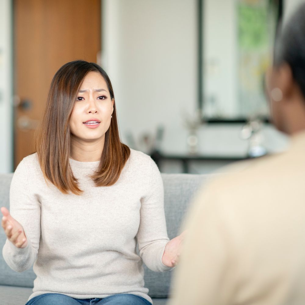 Woman speaking emotionally during counseling session